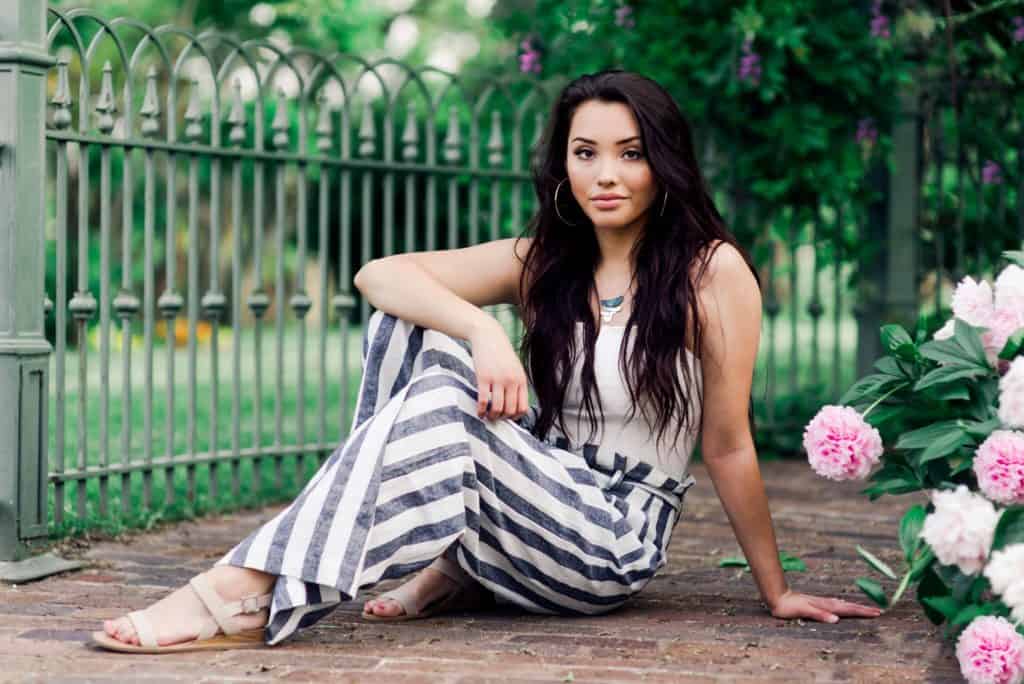 Senior portraits, Gilcrease museum, pink flowers, white flowers, romper